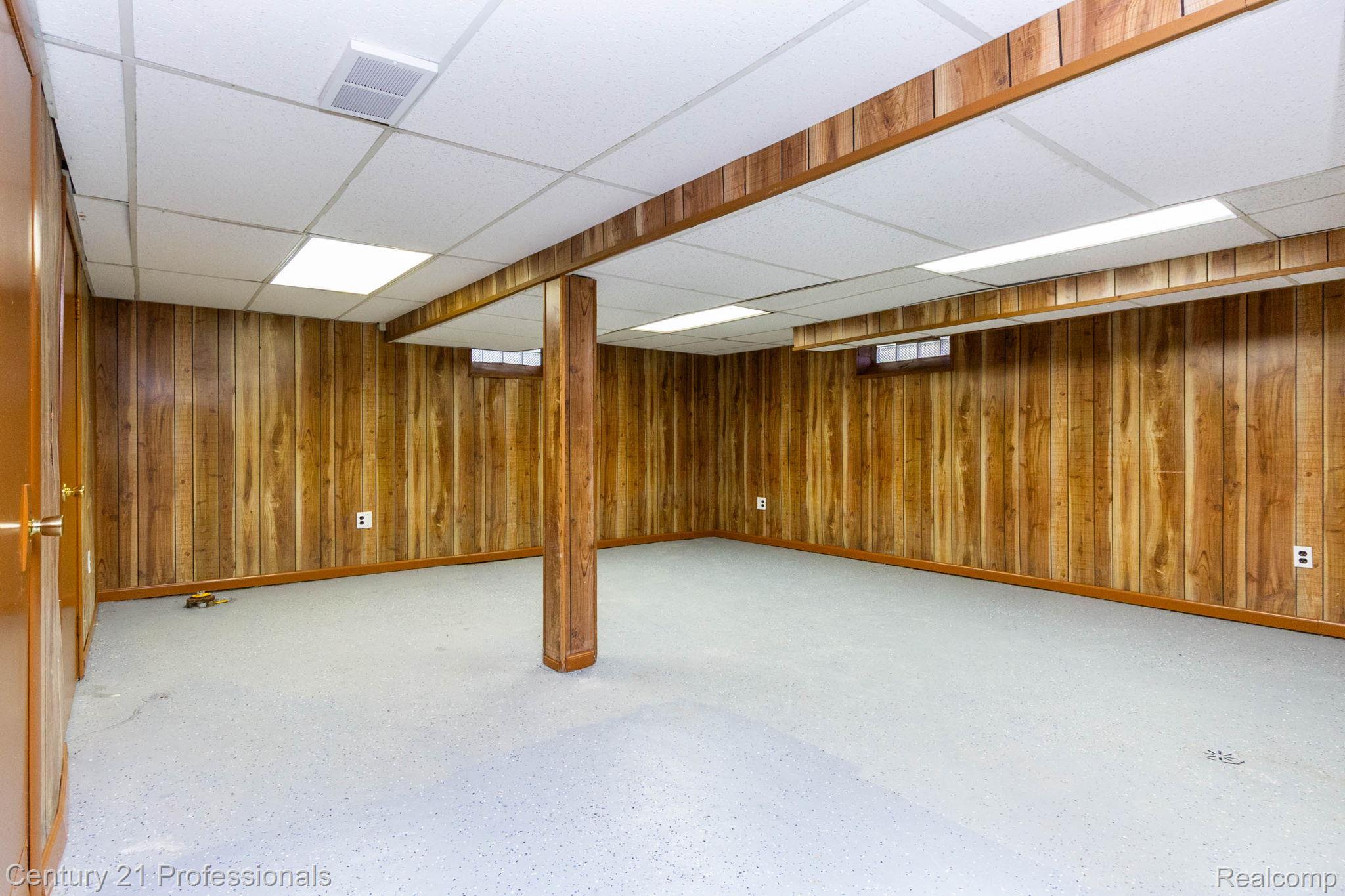 18951 Edinborough Road Detroit, MI 48219 - Photo 22 of 47 Finished below grade area featuring wooden walls and a drop ceiling