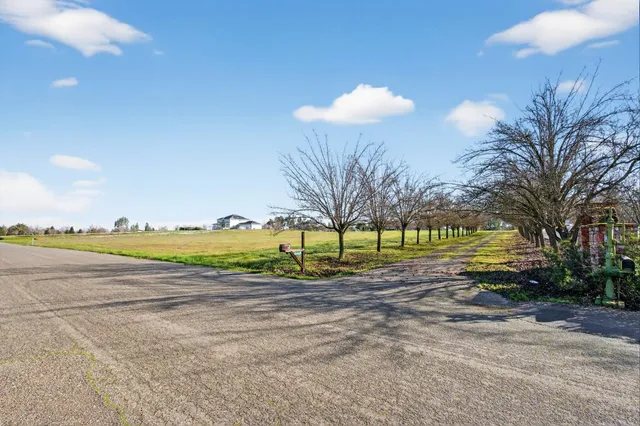 a view of a lake with a yard