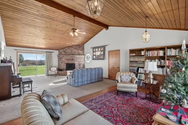a kitchen with stainless steel appliances granite countertop a stove sink refrigerator and cabinets