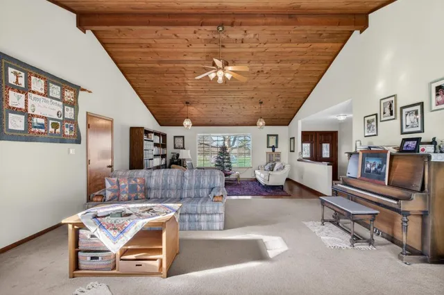 a view of a hallway with wooden floor and glass door