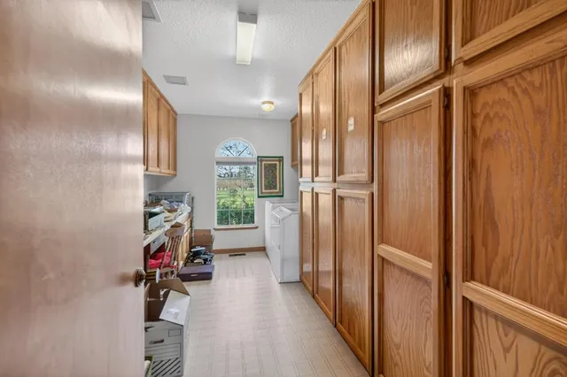 a reading room with furniture and a window
