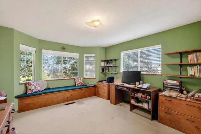 a view of a balcony with lake view and a wooden floor