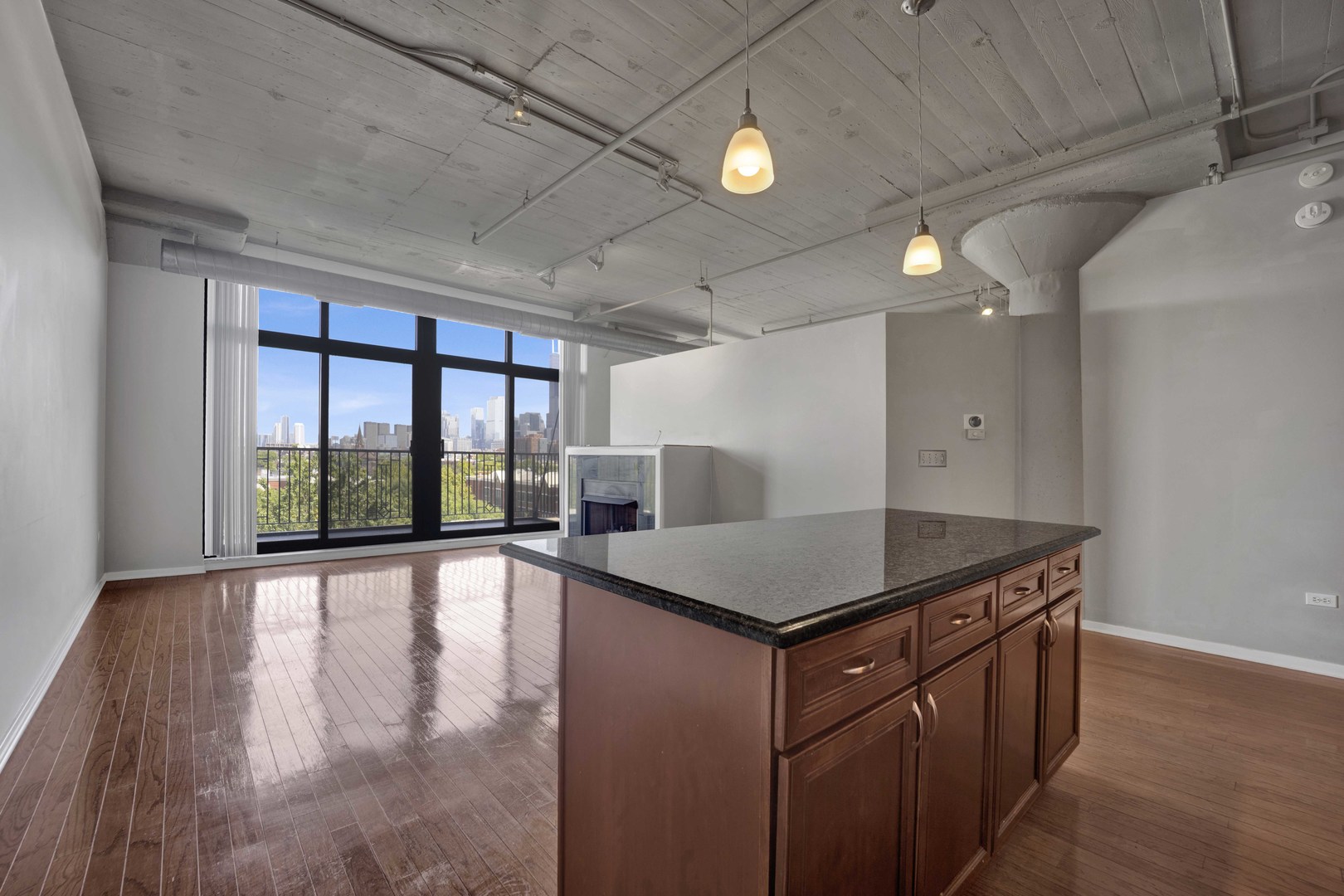 1525 South Sangamon Street, Unit 504 Chicago, IL 60608 - Photo 8 of 32 a kitchen that has a cabinets counter space and a sink