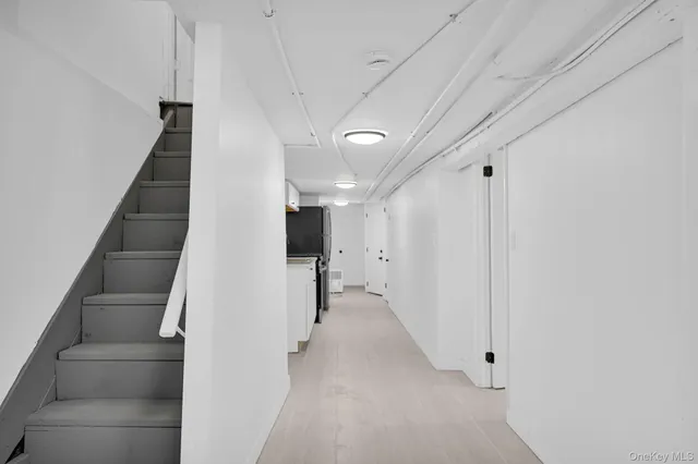 a view of a hallway with stairs
