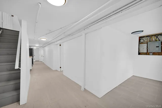 a bathroom with a sink mirror and toilet