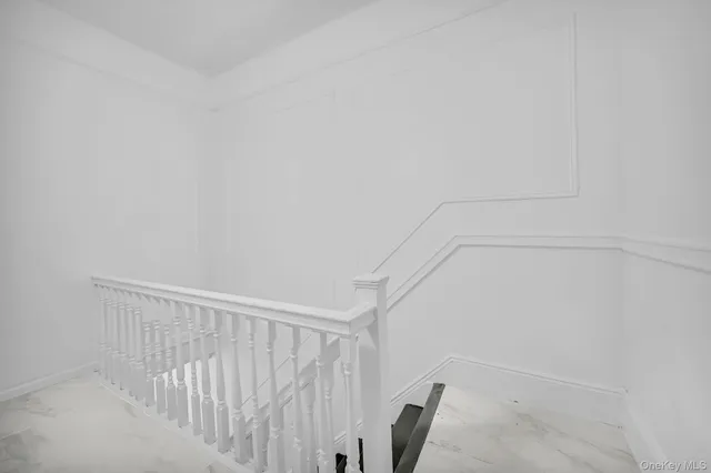 a kitchen with a stove and white cabinets