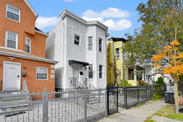 a front view of a house with glass windows