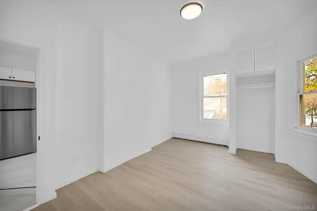 a utility room with refrigerator dryer and washer