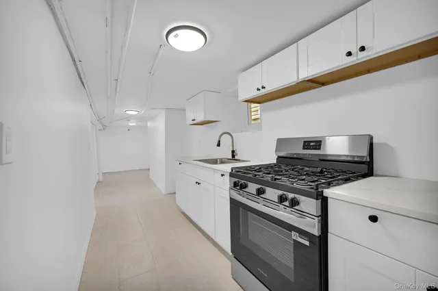 a bathroom with a sink and mirror