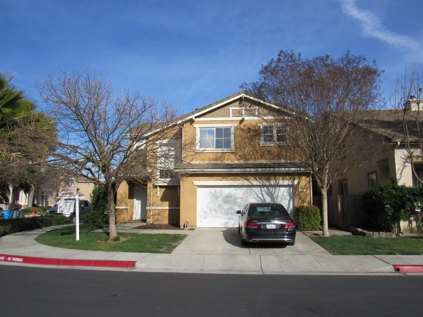 8952 Del Rio Circle Gilroy, CA 95020 - Photo 2 of 8 a car parked in front of a house