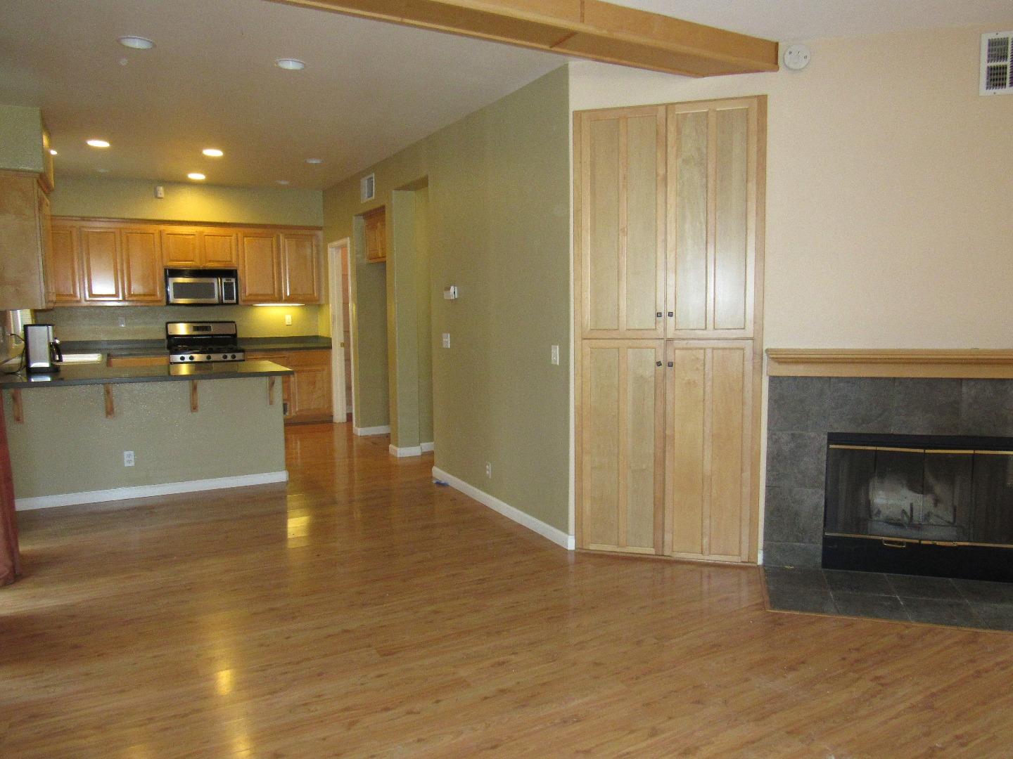 8952 Del Rio Circle Gilroy, CA 95020 - Photo 6 of 8 a view of a kitchen with a sink and a fireplace