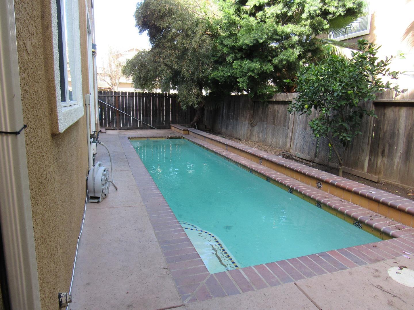 8952 Del Rio Circle Gilroy, CA 95020 - Photo 8 of 8 a view of swimming pool with a patio and a yard