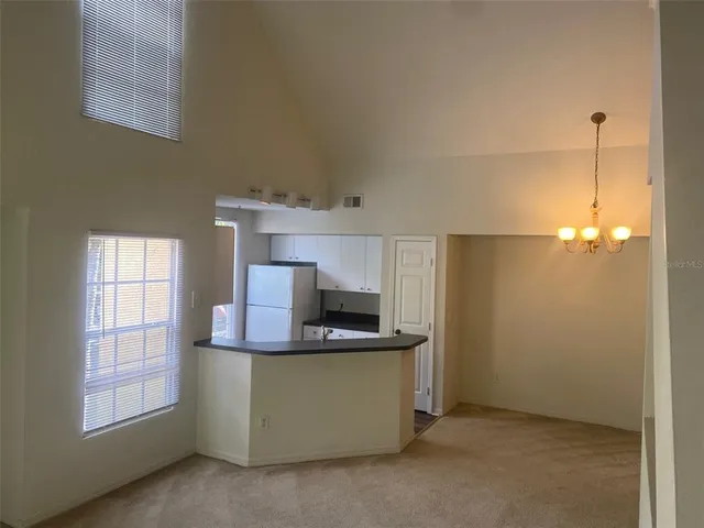 a kitchen with stainless steel appliances a stove a microwave a sink and cabinets