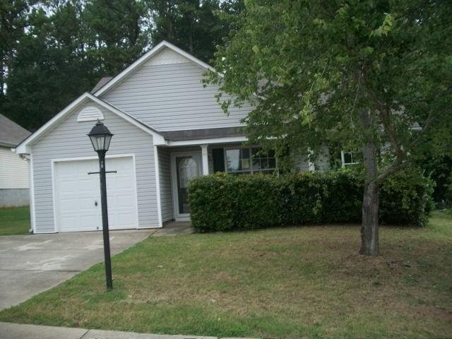 147 Misty Ridge Trail Stockbridge, GA 30281 - Photo 1 of 1 a view of a house with backyard and garden