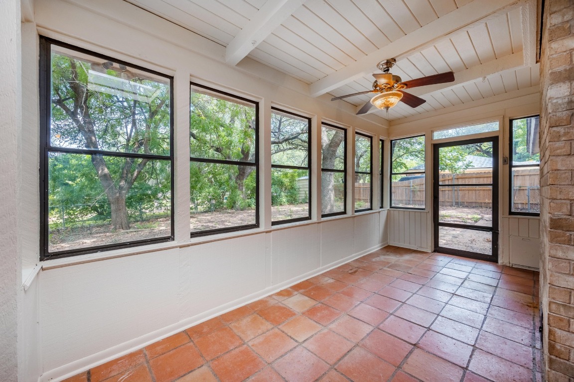 12319 Double Tree Lane Austin, TX 78750 - Photo 12 of 27 a view of a livingroom with a ceiling fan and window