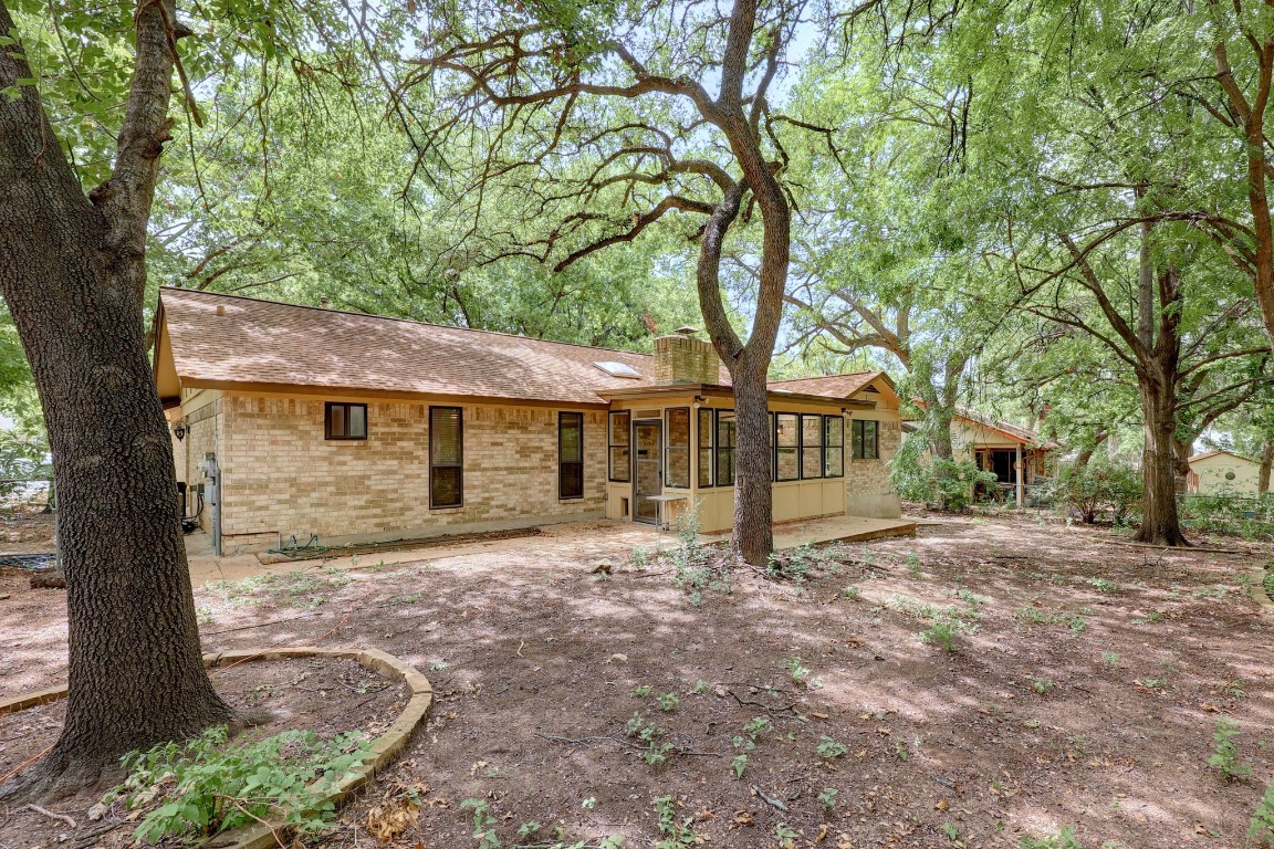 12319 Double Tree Lane Austin, TX 78750 - Photo 18 of 27 a view of a house with a tree in front of it