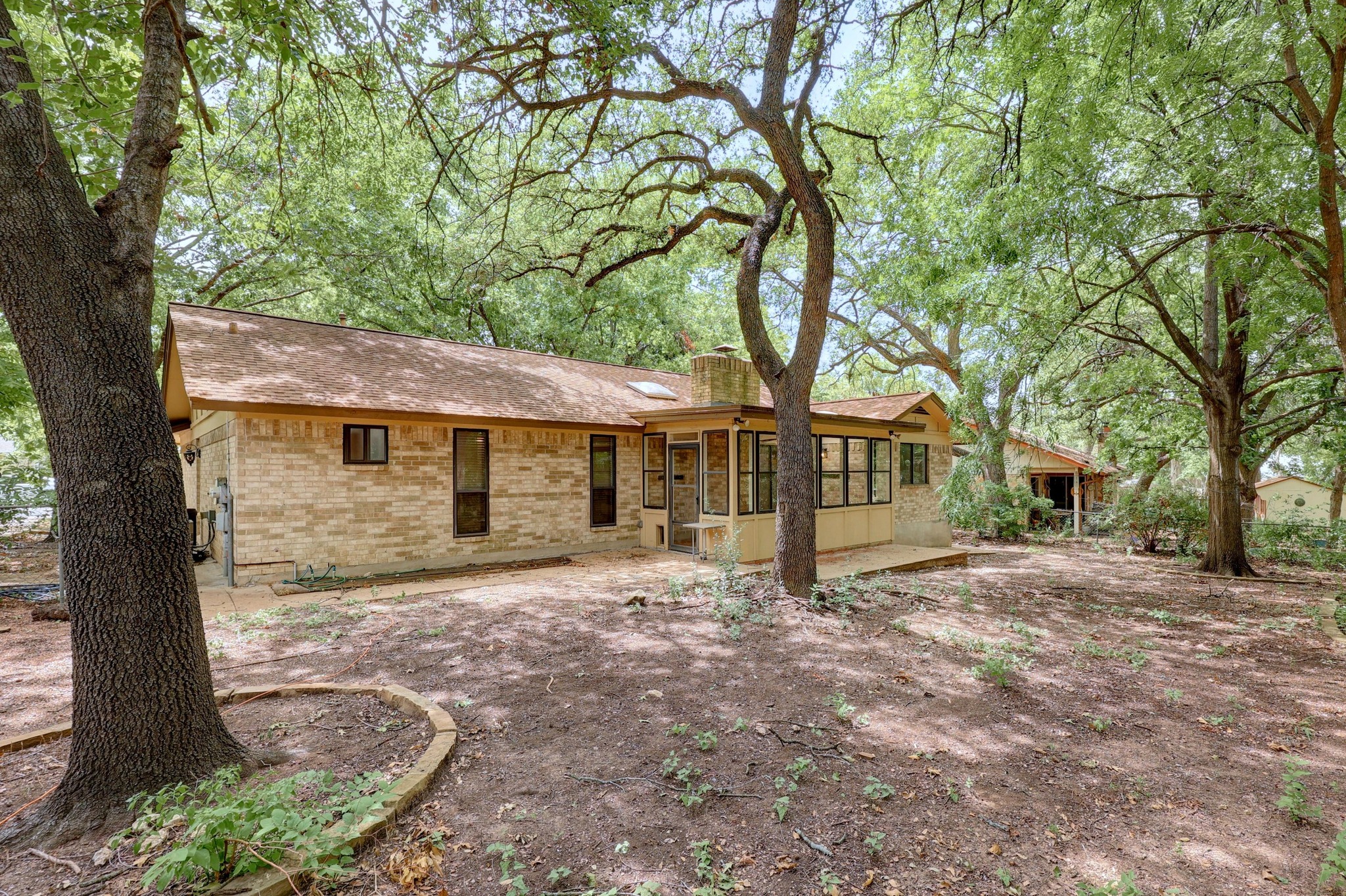 12319 Double Tree Lane Austin, TX 78750 - Photo 18 of 27 a view of a house with a tree in front of it