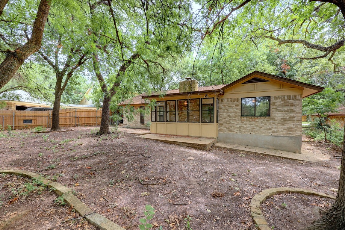 12319 Double Tree Lane Austin, TX 78750 - Photo 19 of 27 a front view of a house with a garden