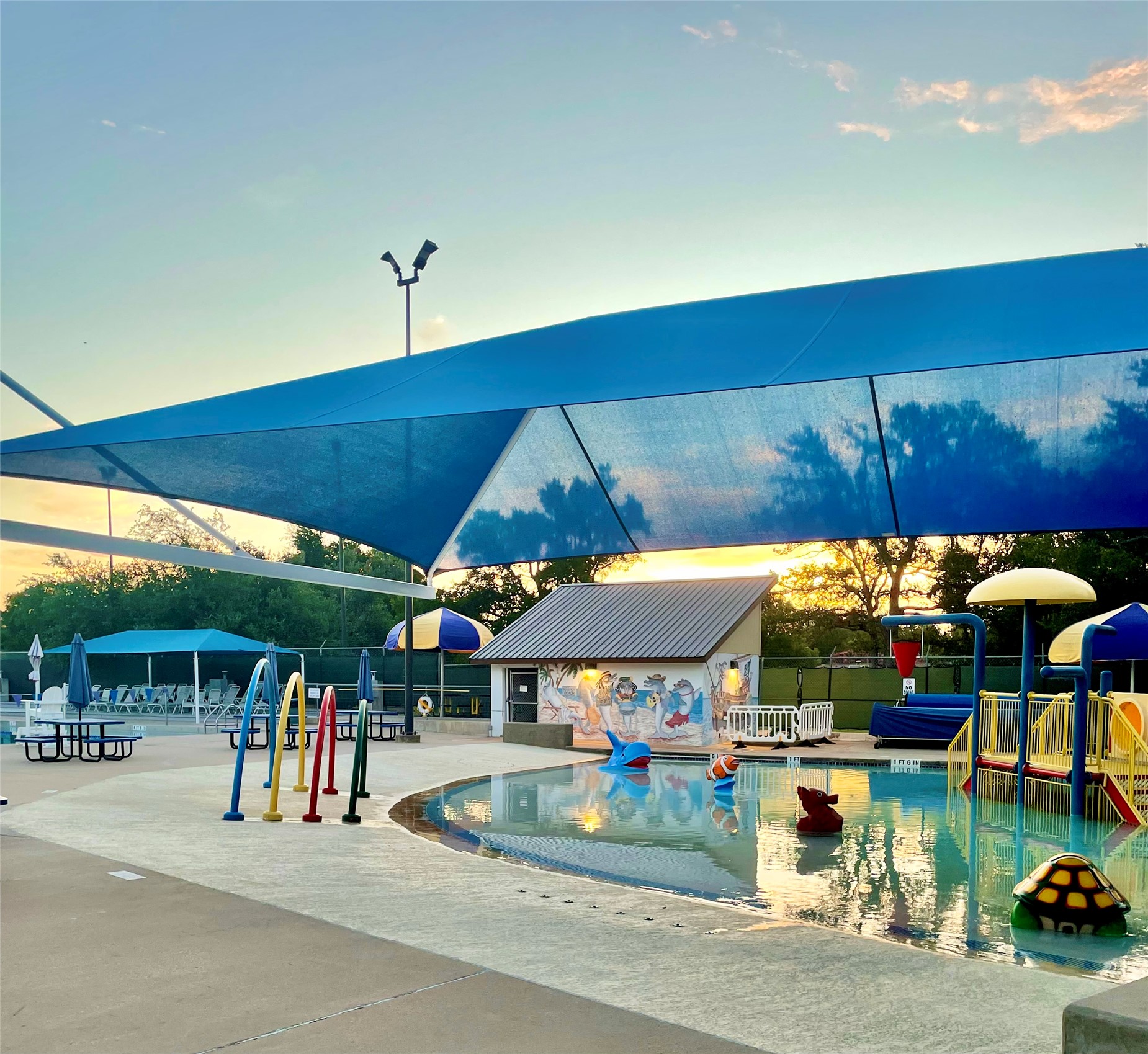 12319 Double Tree Lane Austin, TX 78750 - Photo 22 of 27 a view of a patio with table and chairs under an umbrella