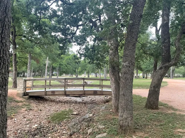 a view of a house with a yard and plants