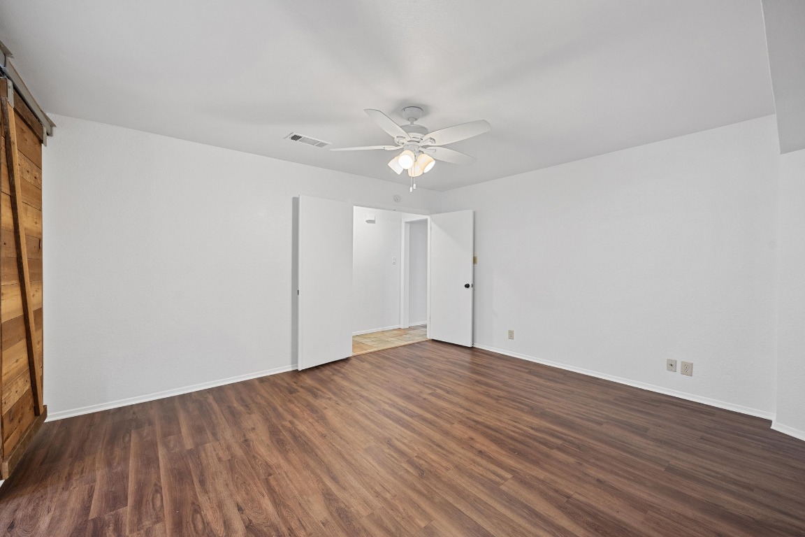 12319 Double Tree Lane Austin, TX 78750 - Photo 6 of 27 a view of an empty room with wooden floor