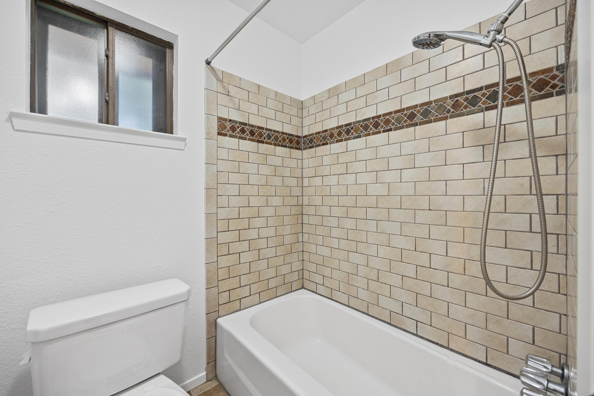 12319 Double Tree Lane Austin, TX 78750 - Photo 8 of 27 a bathroom with a toilet and a shower