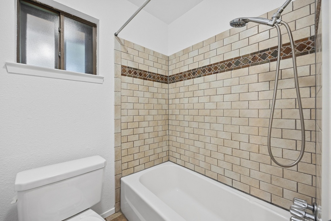 12319 Double Tree Lane Austin, TX 78750 - Photo 8 of 27 a bathroom with a toilet and a shower