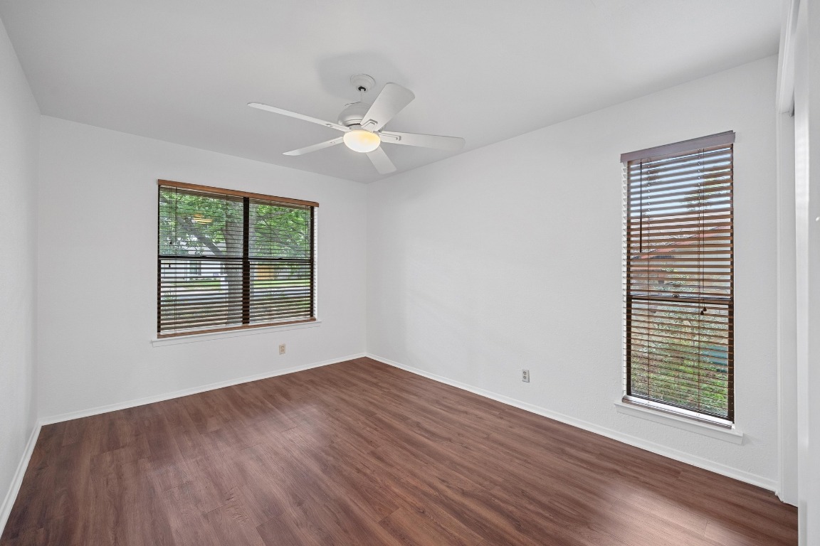 12319 Double Tree Lane Austin, TX 78750 - Photo 9 of 27 wooden floor in an empty room with a window