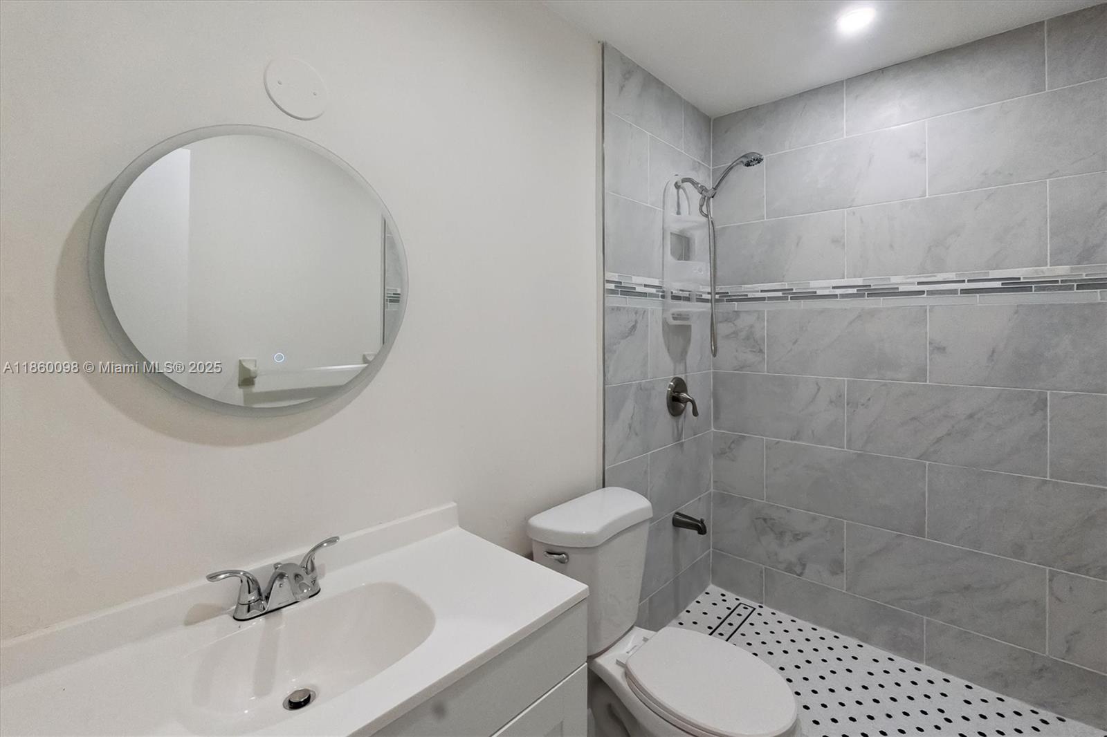 5975 Southwest 137th Avenue, Unit 702 Miami, FL 33183 - Photo 14 of 21 a bathroom with a sink a toilet and shower
