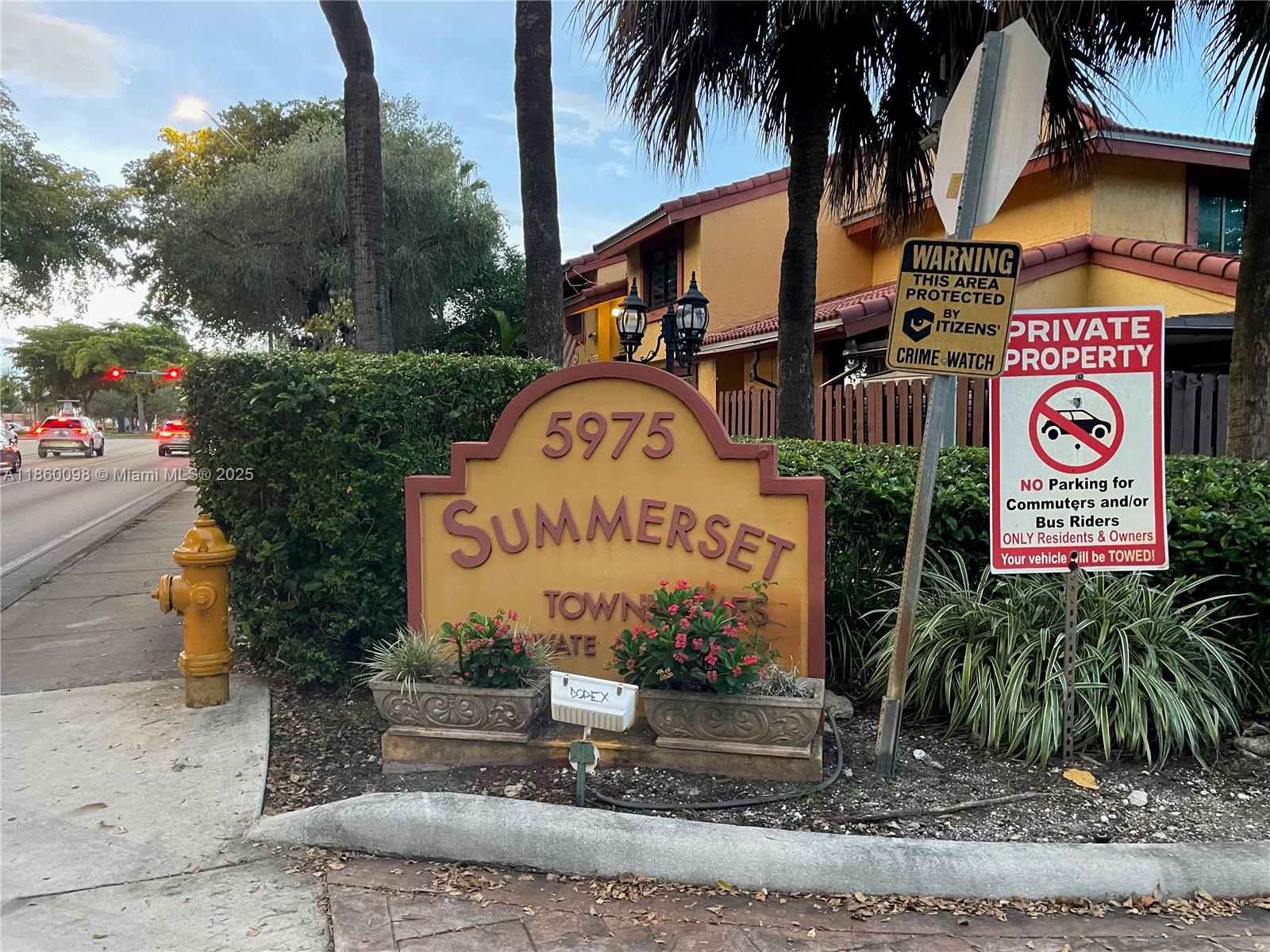 5975 Southwest 137th Avenue, Unit 702 Miami, FL 33183 - Photo 2 of 21 a sign on the side of a road