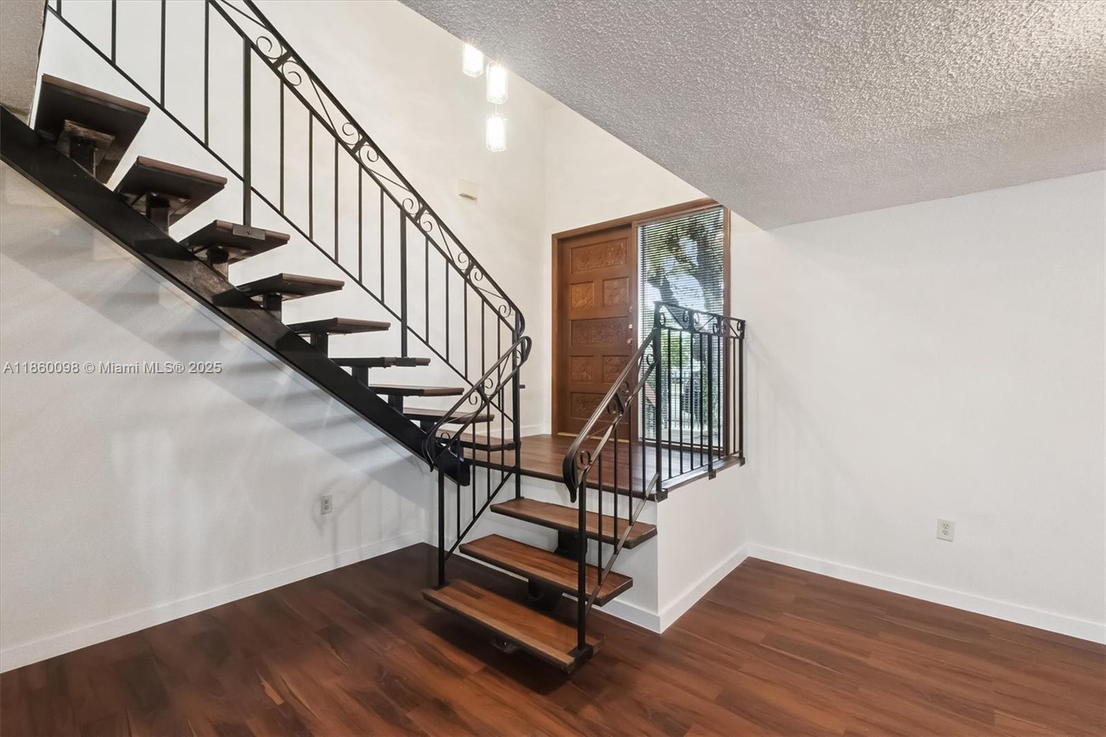 5975 Southwest 137th Avenue, Unit 702 Miami, FL 33183 - Photo 5 of 21 a view of entryway with wooden floor