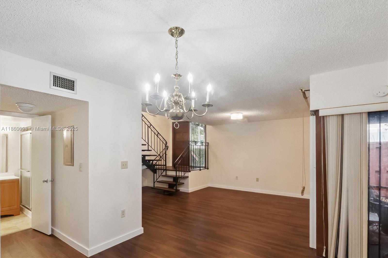 5975 Southwest 137th Avenue, Unit 702 Miami, FL 33183 - Photo 8 of 21 a view of a room with wooden floor