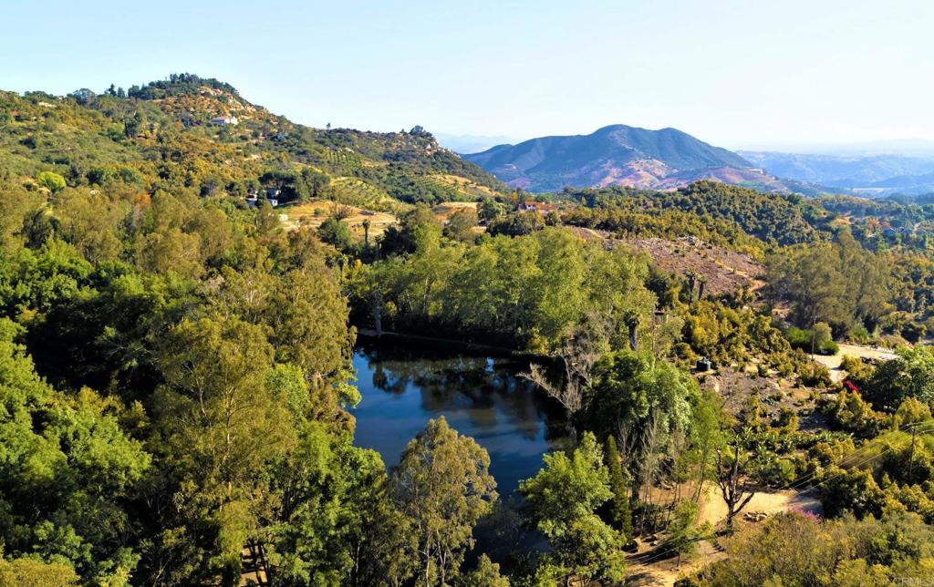 6036 Rainbow Heights Road Fallbrook, CA 92028 - Photo 16 of 70 a view of a lake with mountains in the background