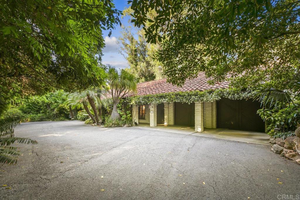 6036 Rainbow Heights Road Fallbrook, CA 92028 - Photo 2 of 70 a front view of a house with yard and trees