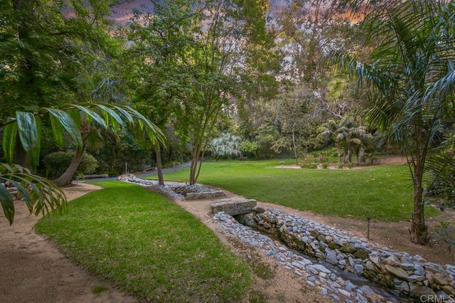 a kitchen with stainless steel appliances granite countertop a stove and a refrigerator