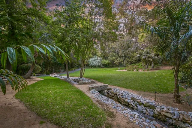 a kitchen with stainless steel appliances granite countertop a stove and a refrigerator