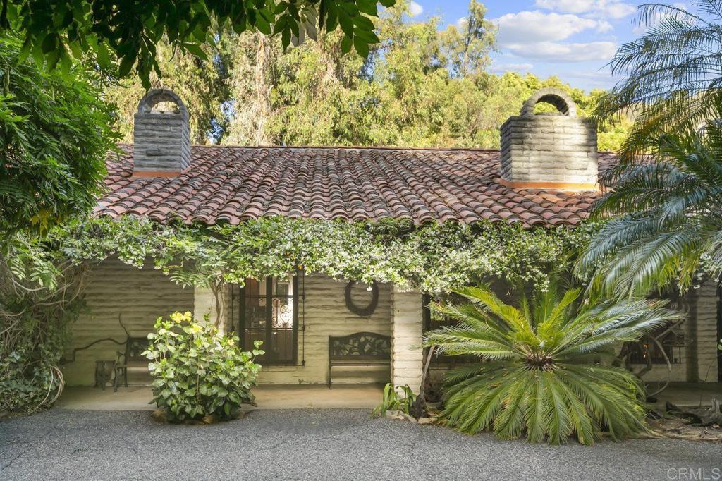 6036 Rainbow Heights Road Fallbrook, CA 92028 - Photo 26 of 70 a front view of a house with a garden