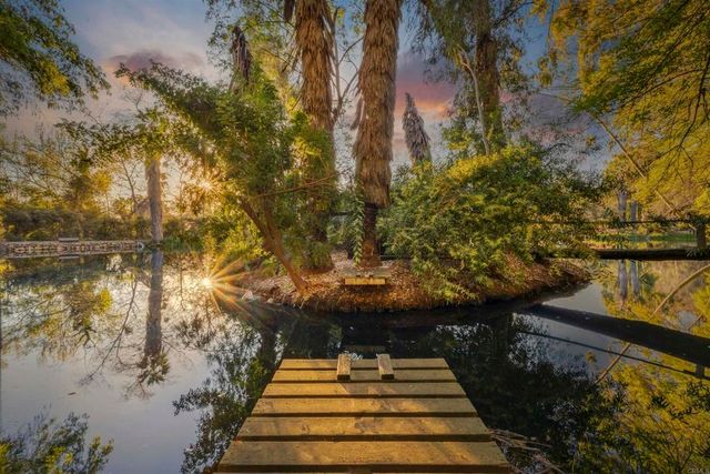 a view of outdoor space with wooden bridge