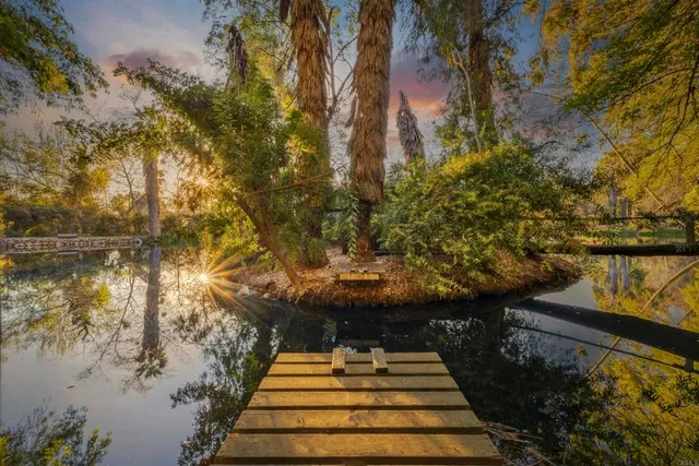 a view of outdoor space with wooden bridge