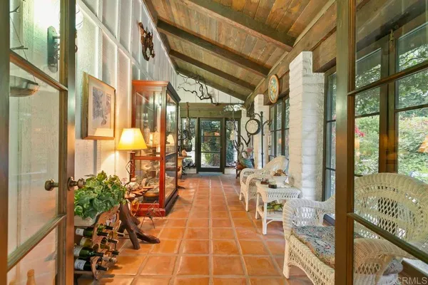 a view of a backyard with plants and a patio