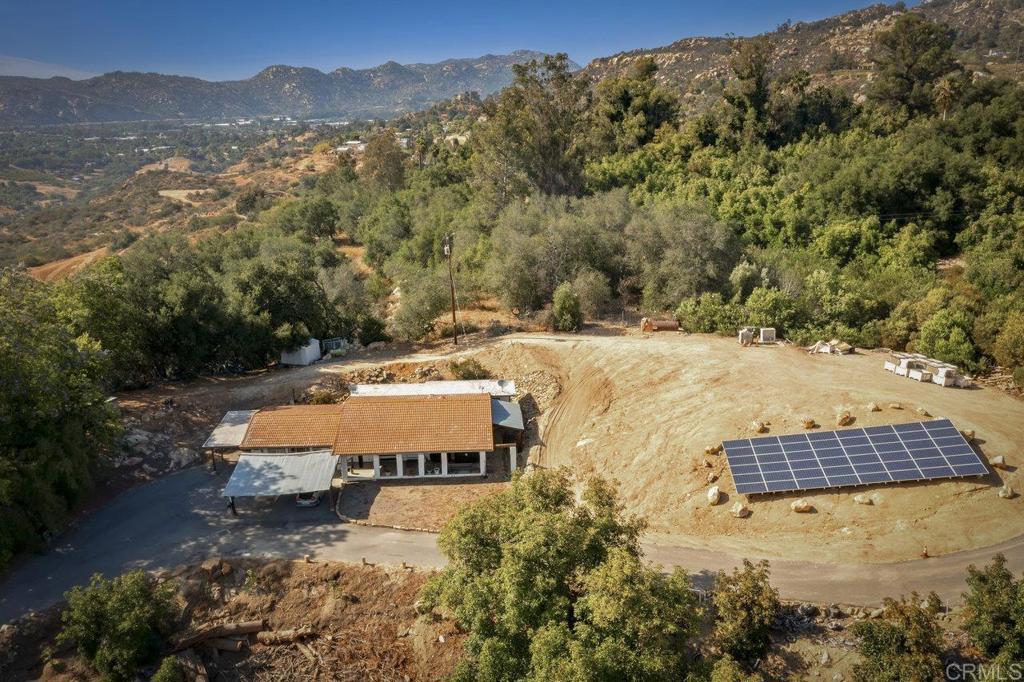 6036 Rainbow Heights Road Fallbrook, CA 92028 - Photo 69 of 70 a view of a house with a yard and mountain view