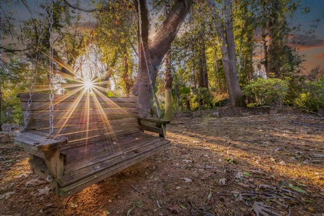 a view of swimming pool with a yard