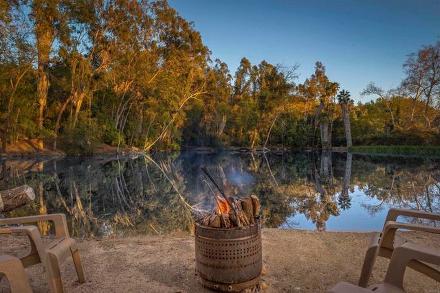 a view of a lake with mountains in the background