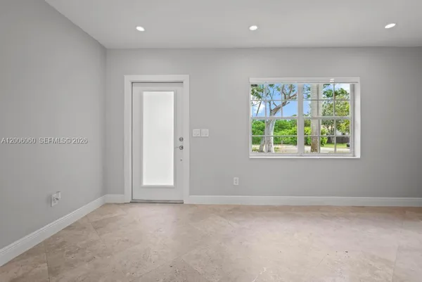 an empty room with windows