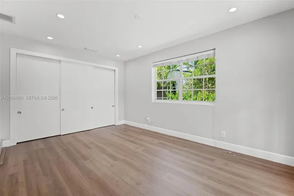 a view of an empty room with a window