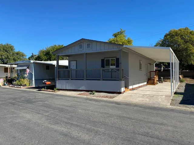 a view of a house with a outdoor space and porch