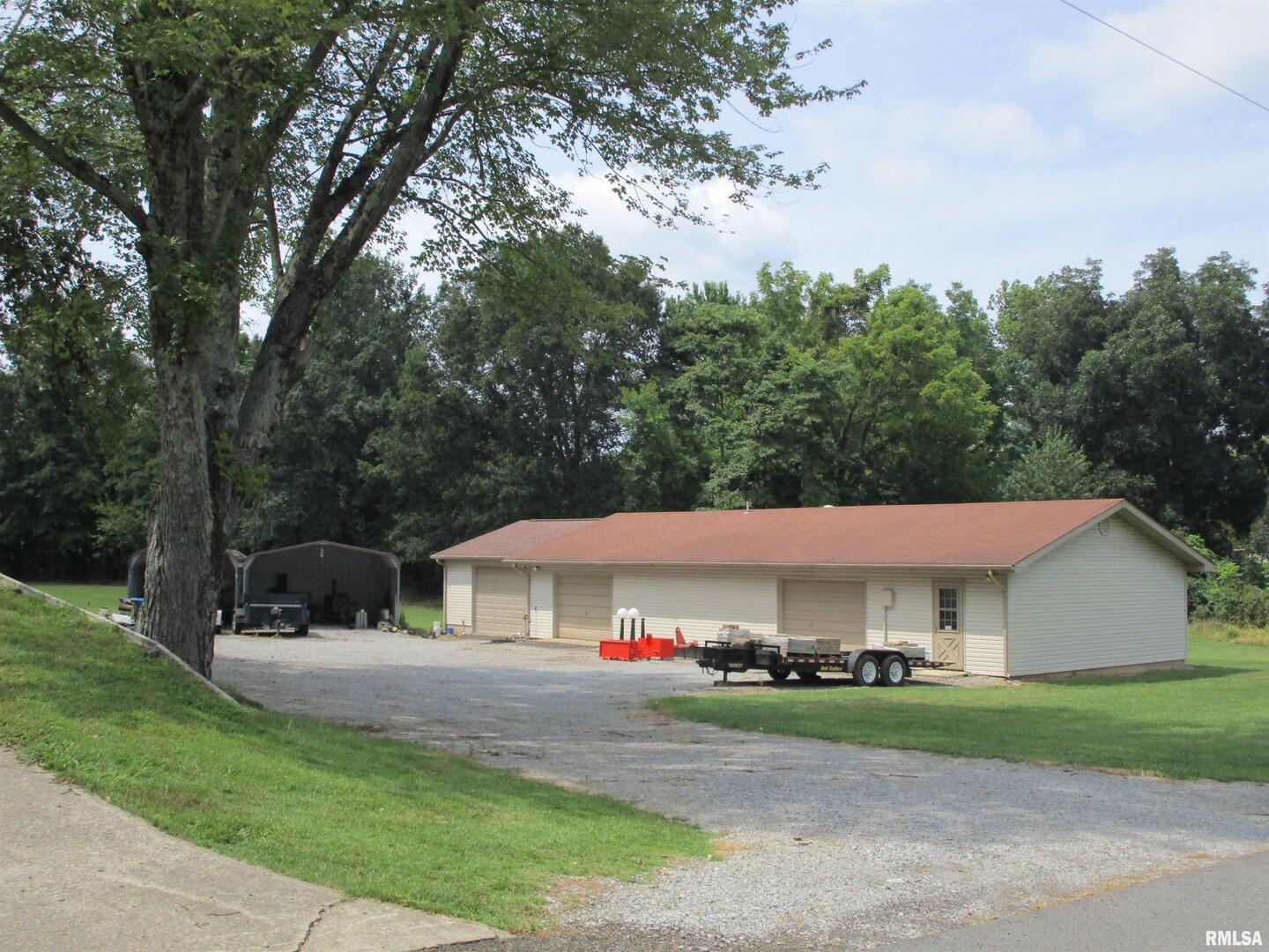 1253 County Road 800 East Carmi, IL 62821 - Photo 31 of 51 a view of house in front of a big yard with large trees