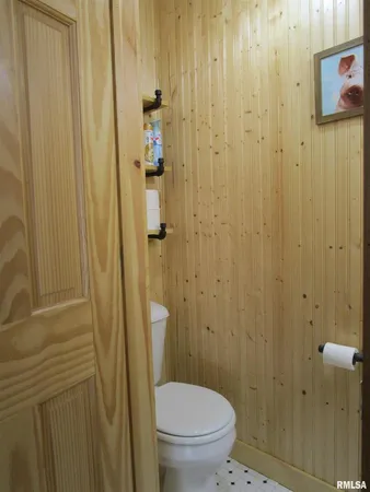 a bathroom with a mirror and a shower