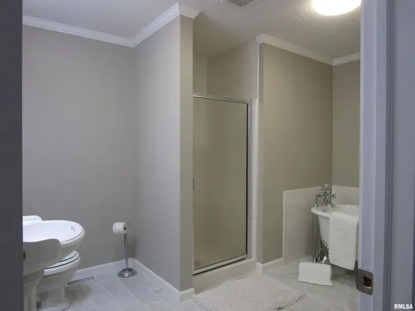 a bathroom with a sink and shower