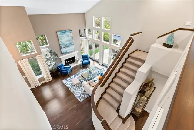 a spacious bedroom with a bed and a large window